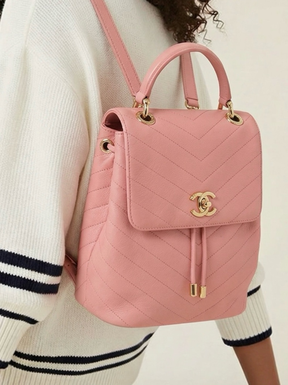 CHANEL Pink Quilted Leather Drawstring Backpack with Gold CC